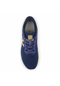 Navy mesh running shoe with light grey sole, purple laces, and gold accents on the logo and tongue. Breathable material with textured surface.
