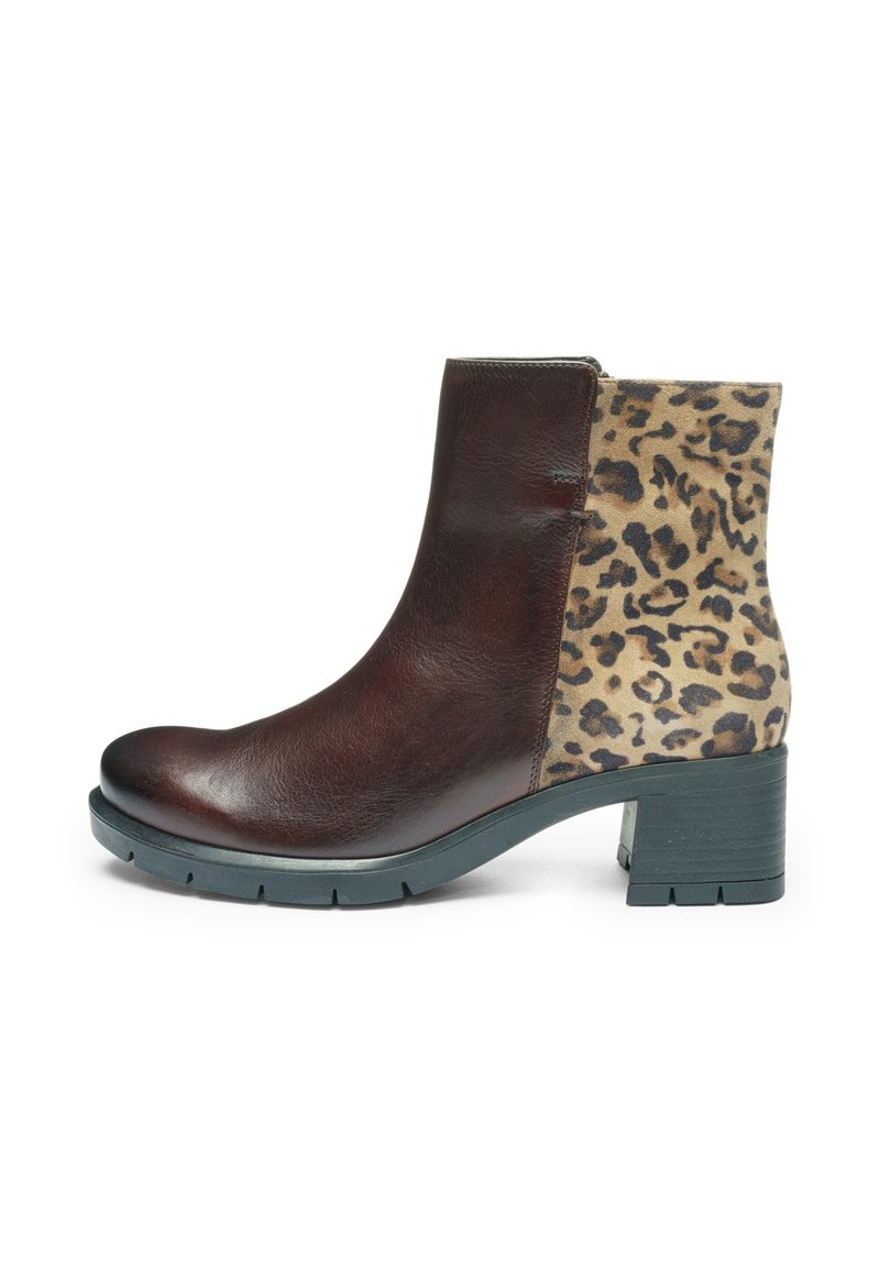 Brown leather ankle boot with a leopard print suede panel. Features a chunky black heel and textured sole. Side zip fastening.