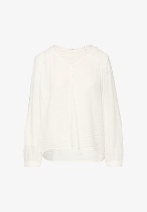 Balta ilgomis rankovėmis bluzonė su V formos iškirpte, mygtukų užsegimu ir tekstūruotu audiniu. Yra surinktos petnešos ir šiek tiek išlenktas apatinis kraštas.