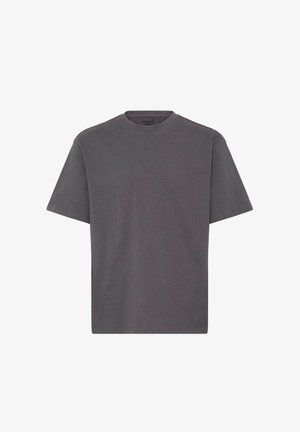 Šedé bavlněné tričko s kulatým výstřihem, krátkými rukávy a volným střihem. Jednobarevné bez viditelných vzorů nebo akcentů.