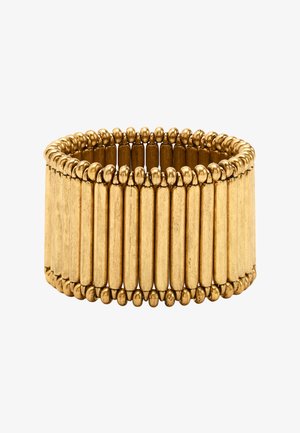 Szeroka rozciągliwa bransoletka w złotym odcieniu, złożona z pionowych zaokrąglonych prętów połączonych małymi okrągłymi koralikami na krawędziach.