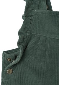 Green corduroy overalls featuring ruffled shoulder straps, brass button accents, and vertical ribbed texture.