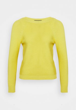 Pull en tricot jaune avec un col rond, de longues manches raglan et des poignets côtelés, présentant un motif texturé sur l'ensemble du tissu.