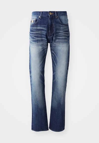 Sötétkékből világoskékbe ágradáló farmernadrág, öt zsebbel, gombos záródással és finom elhalványodási részletekkel a combokon.