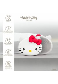 Hello Kitty silikon kroppsskrubba, vit med ett rött välbröd, har en texturerad baksida, vattentålig design och är dermatologisk godkänd för alla hudtyper.