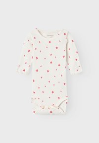 Long-sleeve baby bodysuit in cream with scattered pink heart patterns, featuring a round neckline and snap closures at the bottom.