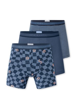 Three pairs of blue men's boxer briefs, one with checkerboard and smiley print, one solid blue, and one with white horizontal stripes.
