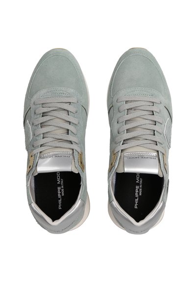 Grey suede sneakers with light grey laces, silver accents, and dark insoles. Features a stitched design and a textured sole for grip.