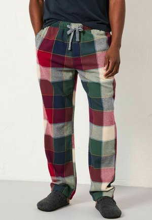 Plaid lounge pants with an elastic waistband, featuring red, green, blue, and beige squares. Soft fabric with a drawstring accent.