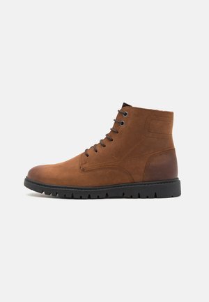 GHIACCIAIO - Winter boots - coffee