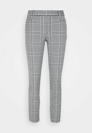 Pantalon à carreaux gris et noir avec une coupe slim, doté de poches latérales et d'une texture lisse, design ajusté sans fermetures visibles.