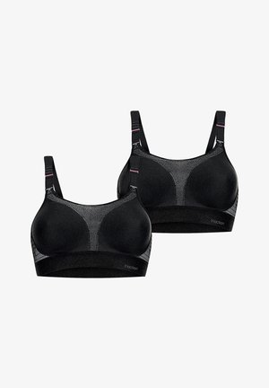 Sujetadores deportivos negros con paneles de malla, tela suave, tirantes anchos y diseño de soporte. Con detalles de marca y un patrón texturizado sutil.