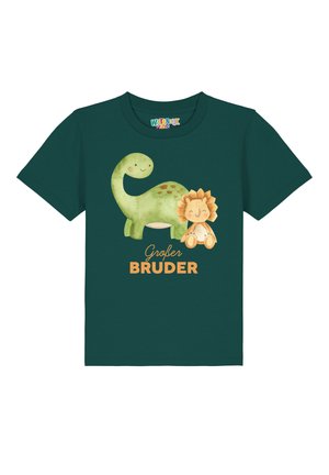 Groene katoenen T-shirt met een grafiek van een dinosaurus en een leeuw. De tekst "Großer Bruder" staat in oranje onder de illustraties. Korte mouwen.