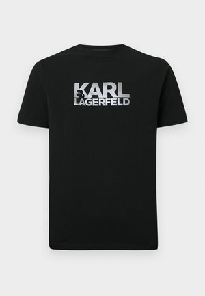 T-shirt en coton noir avec un logo argenté imprimé "KARL LAGERFELD" comprenant une silhouette stylisée. Manches courtes et encolure ronde.