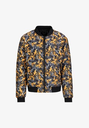 Bomberjack met een zwarte basis en een spiraalvormig geel en grijs bloemmotief, zwarte geribde manchetten en een rits aan de voorkant.