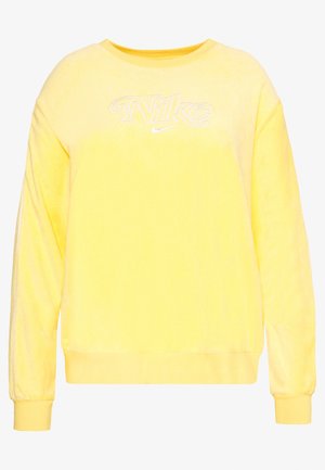 Sweat-shirt jaune à manches longues col rond avec logo Nike blanc et petit swoosh centré sur la poitrine.