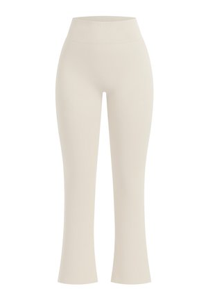 Hoch taillierte, hellbeige nahtlose Leggings mit einem breiten, gerippten Bund und einem leicht ausgestellten Beinabschluss.