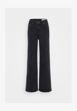 Sorte viddejeans laget av denim, med høy midje, knappelukking og oransje søm detaljer. Jevn tekstur med minimal falming.