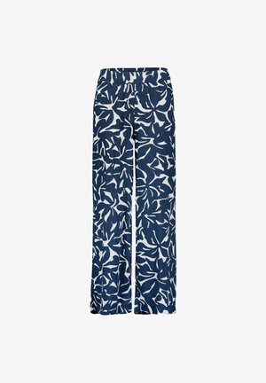 Pantalon large bleu marine et blanc avec des motifs abstraits de feuilles et une taille élastique.
