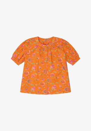 Korte mouwen, oranje blouse met een bloemmotief in roze en groen. Voorzien van een geplooide halslijn en een knoopsluiting aan de voorkant. Gemaakt van katoen.