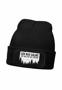 Black knit beanie with a ribbed texture. Features a rectangular patch displaying white text and a forest graphic.