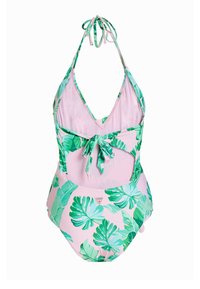 Costume intero color rosa chiaro con motivo tropicale di foglie verdi, scollo all'americana con lacci al collo e design con schiena scoperta. Tessuto morbido con una forma aderente.