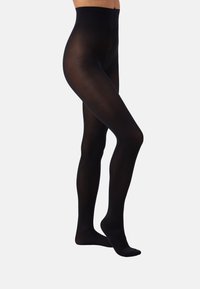 Collant neri opachi con vita alta, texture liscia e design con piedi, che mostrano una finitura senza cuciture dalla vita alle dita dei piedi.