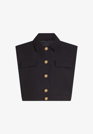 Must musta varrukateta krae kahel klapiga taskul ja viie kuldse nupuga keskjoonel, igaüks graveeritud ümmarguse monogrammiga.