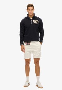 Superdry & Co EMBOSSED - Pantalon de survêtement - new chalk white