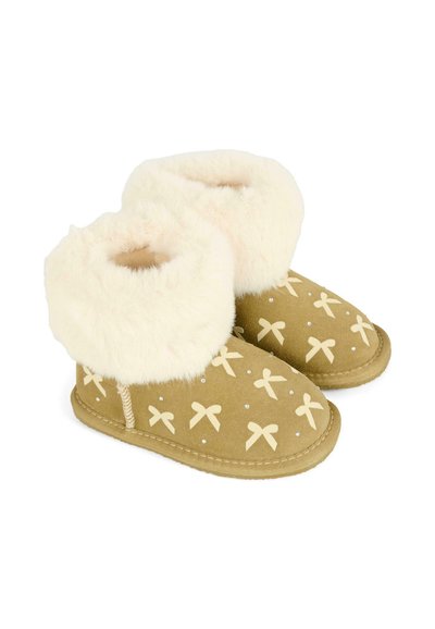 Tan enkellaarsjes met een crèmekleurige bontvoering en kleine strikpatronen, ontworpen voor warmte en comfort.