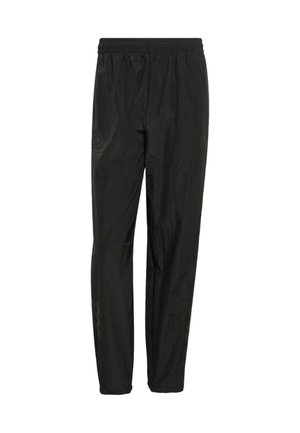 Zwarte, lichtgewicht joggerbroek met een elastische tailleband en een subtiel logodetail. Gladde textuur met taps toelopende pijpen en zonder zakken.