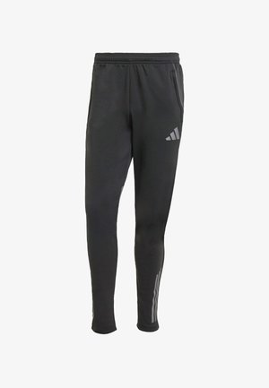 Black athletic pants with a snug fit, made from soft fabric. Features an elastic waistband, side pockets, and three white stripes on the lower legs.