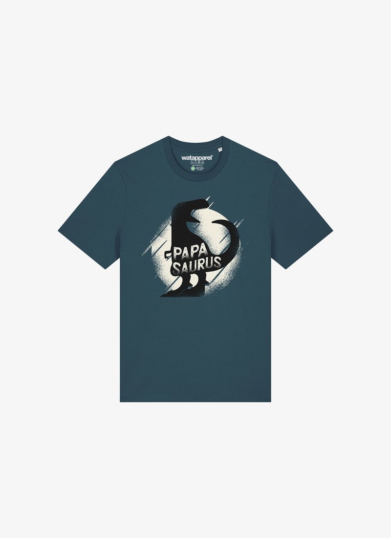 T-shirt teal en coton à manches courtes. Présente un graphique de dinosaure noir et le texte "PAPA SAURUS" en blanc, sur un design circulaire.