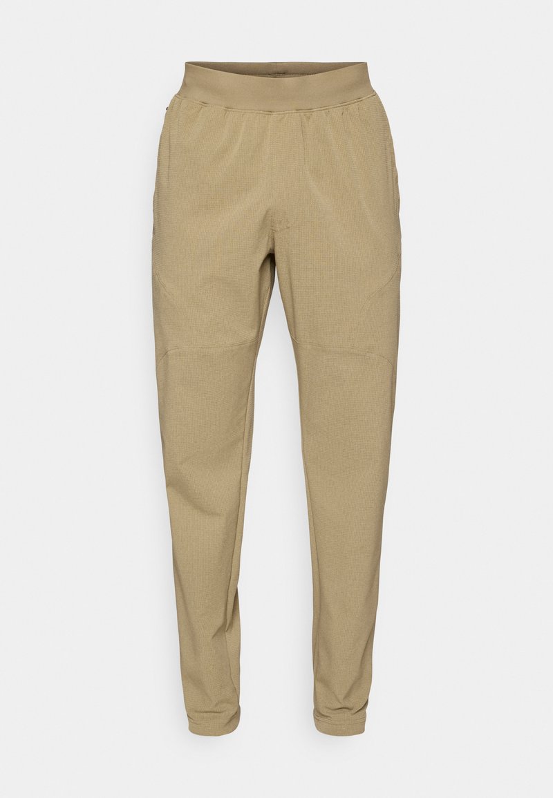 Beige schmal zulaufende Hose mit elastischem Bund, strukturiertem Stoff, Seitentaschen und gerafften Bündchen an den Knöcheln.