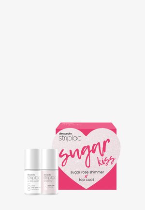 Deux flacons de vernis à ongles Alessandro Striplac étiquetés "couche de finition UV" et "paillettes rose sucre" à côté d'un emballage rose avec un cœur et le texte "Sugar Kiss".