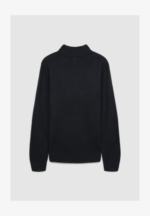 Maglione nero con un collo alto a costine, maniche lunghe e un design a maglia testurizzata. Anche il fondo e i polsini delle maniche sono a costine.