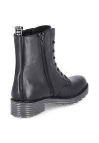 Schwarze Leder-Ankle-Boots mit Schnürung vorne und seitlichem Reißverschluss. Verfügt über eine robuste Sohle mit Rillen und einer Zuglasche an der Rückseite.