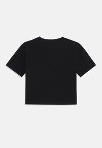 Svart kortärmad t-shirt i mjuk bomull. Har korta ärmar, rund halsringning och en sömlös fåll i botten.