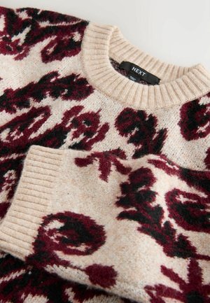 Knit sweater featuring a cream base with maroon and black floral patterns, classic ribbed round neckline and cuffs. Soft texture.