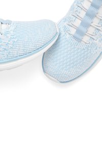 Light blue knitted sneakers featuring a textured upper, white laces, and a padded collar. Rubber sole with a smooth finish.