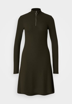 Long-sleeve, ribbed dress in dark olive green with a high collar and a quarter zipper. The hemline is slightly flared for added shape.