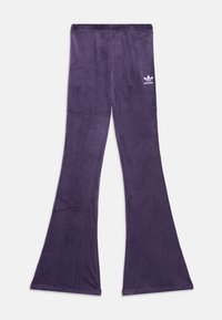 Purpurinės platėjančios kelnės, pagamintos iš minkštos medžiagos, su elastine juosmeniu ir mažuoju baltu Adidas logotipu kairėje šlaunyje.