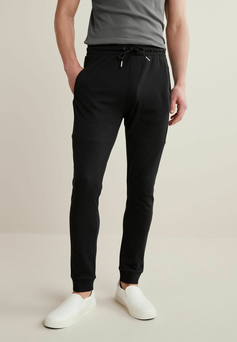 Next JERSEY SKINNY LEG JOGGERS Jogginghose black/schwarz Zalando.at