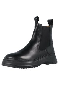 Botas de cuero negro hasta el tobillo con paneles laterales elásticos, tiradores en la parte superior y una suela de goma texturizada. Presenta un acabado suave y una altura de plataforma moderada.