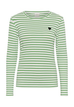 Cămașă albă cu mâneci lungi, dungi orizontale verzi și un mic emblemă neagră în formă de inimă pe partea stângă a pieptului.