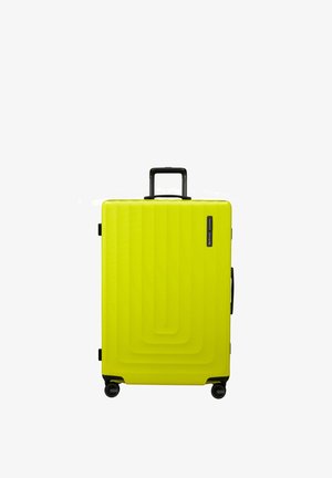 Hard-shell suitcase in bright yellow plastic, featuring a textured wave pattern, a retractable black handle, and four black wheels.