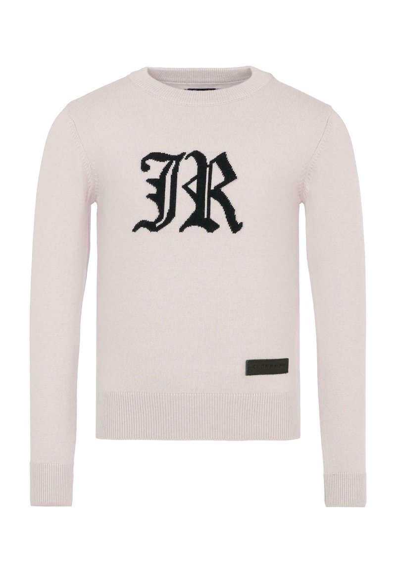 Jasnoróżowy sweter z prążkowanymi mankietami i dołem. Posiada duże czarne wyszywane logo "JR" z przodu, z małą czarną metką na dole.