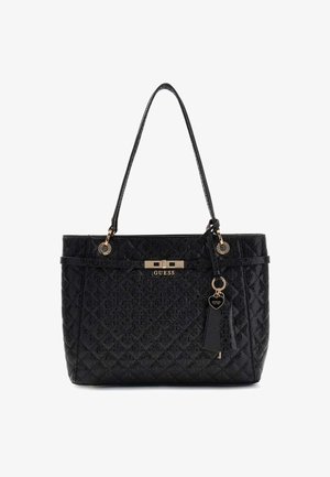Borsa a tracolla nera trapuntata con finitura lucida, doppi manici, dettagli in hardware dorato e un ciondolo a forma di cuore removibile.