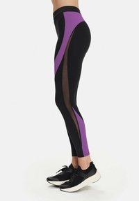 Leggings made of black fabric with purple and mesh accents, featuring a high waistband, form-fitting design, and vertical color blocking.