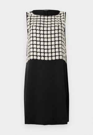 Schwarzes ärmelloses Kleid mit einem strukturierten, bestickten Oberteil mit weißen Blumenmustern. Glatter, einfarbiger schwarzer Unterteil.